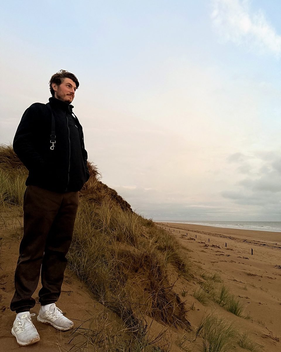 Alexander on a sand dune at the beach